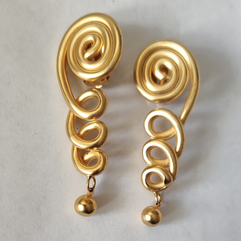 Elegant Gold Swirl Drop Clip On Earrings